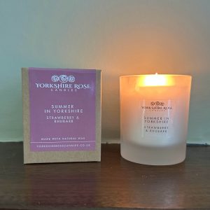 Strawberry and rhubarb scented glass candle